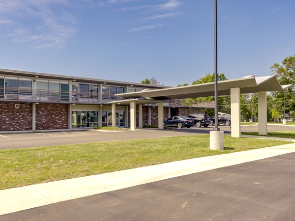 Front view of a midcentury, two-story brick building.