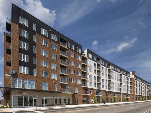 Exterior of a large seven-story apartment building.