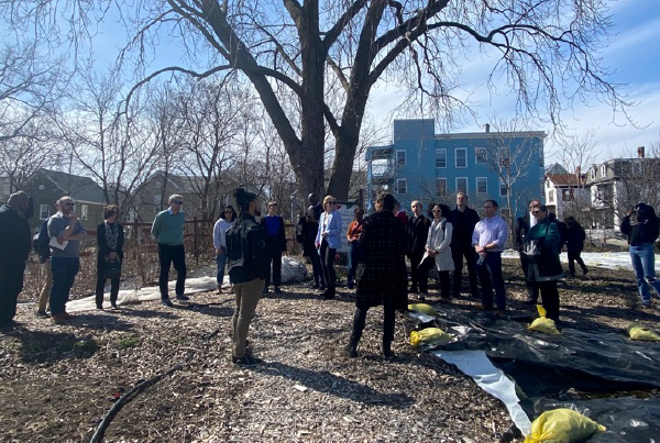 A group of people gathered outside.