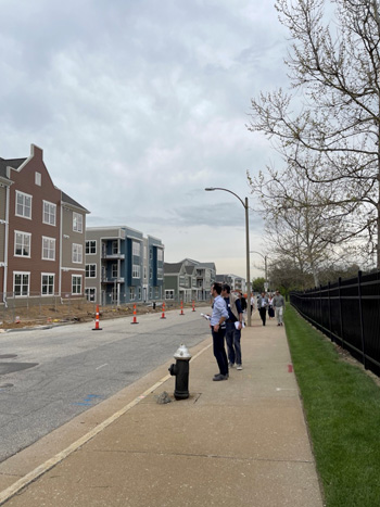 Group of people touring the Preservation Square public housing project.