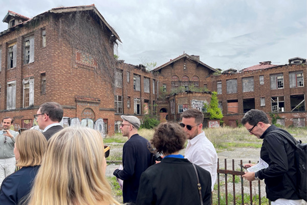 Group of people in front of the Carr School building.