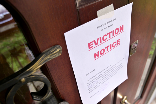 An eviction notice taped to a door.