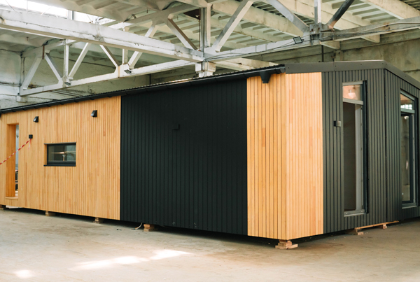 A modular house at a construction site.