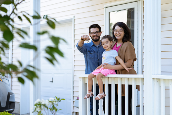 A family in front of a house.