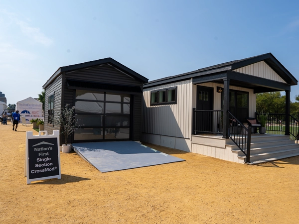 A CrossMod model house on display at the Innovative Housing Showcase. A signboard to the left of the house reads "Nation's First Single Section CrossMod®".