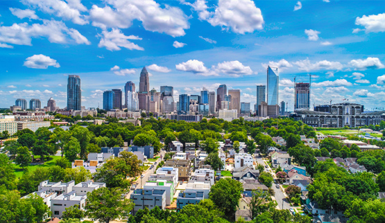 Downtown Charlotte skyline, with residences in the foreground.