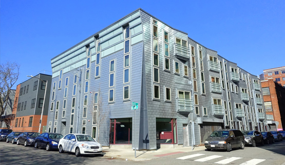 Photograph of several multifamily buildings.