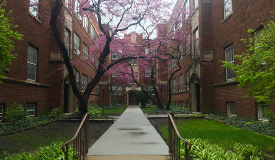 Three-story courtyard apartment building.