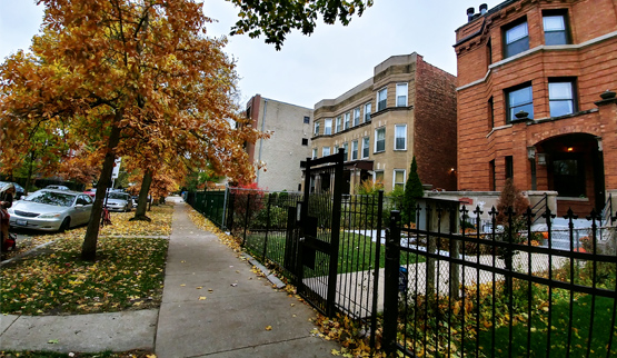 Photograph of the street façades of three- and four-story residences