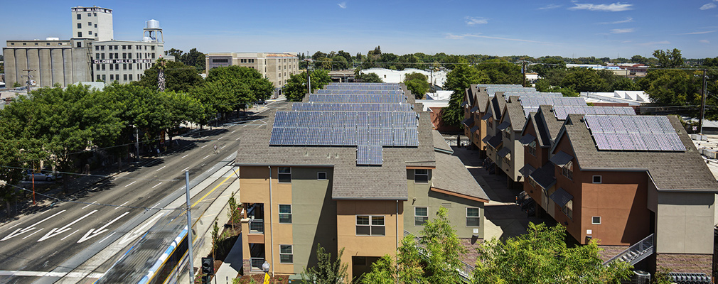 Photograph showing south-facing solar panels on the roofs of the townhouses at La Valentina North.