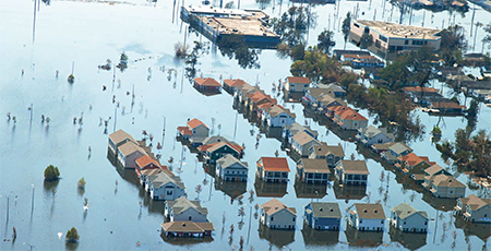 Aerial view of houses partially submerged in flood water from Hurricane Katrina.