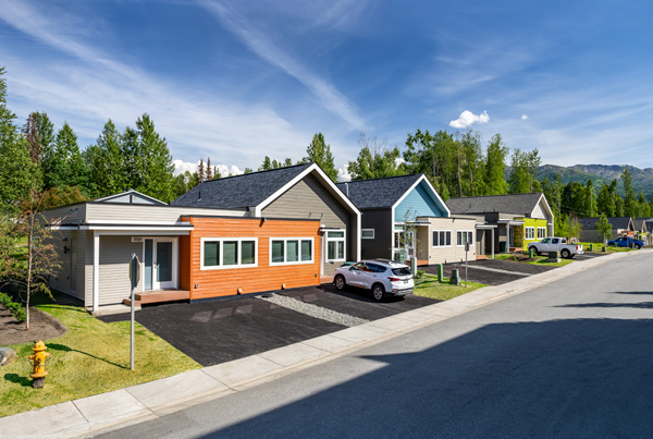 Row of single-story duplex homes. Row of single-story duplex homes.