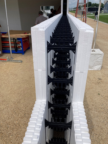 Close-up photo of a partially constructed wall being built with Insulate Concrete Form construction technology. Close-up photo of a partially constructed wall being built with Insulate Concrete Form construction technology.